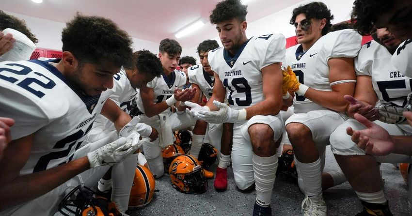  Prayers go on, sometimes out of sight, in prep football