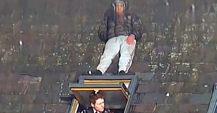 Incredible moment man hides just one foot away from officer on roof during police chase