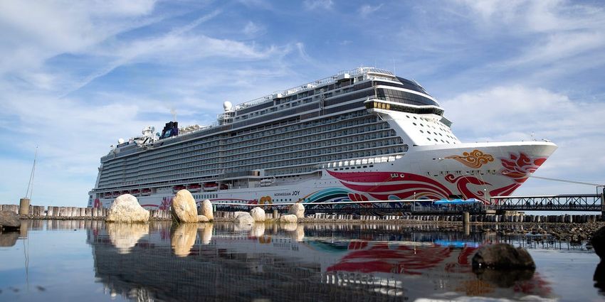  A pair of cruise passengers were arrested after authorities searched their luggage and found 112 bags of marijuana