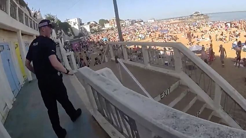  Moment police rush onto packed beach to arrest ‘drunk’ youngsters and pour out booze during bank holiday heatwave madness